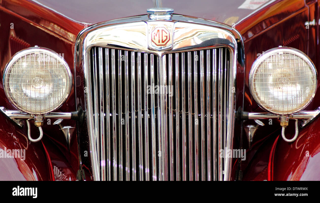 Close-up vintage MG car grille, headlights and logo, England, UK Stock Photo
