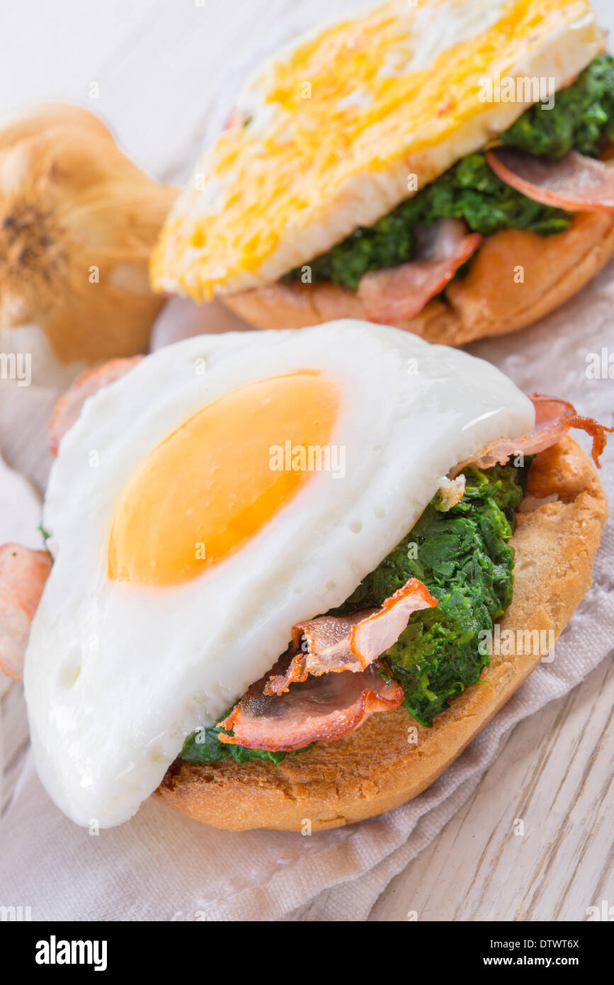 Bread au gratin with fried egg and spinach Stock Photo Alamy