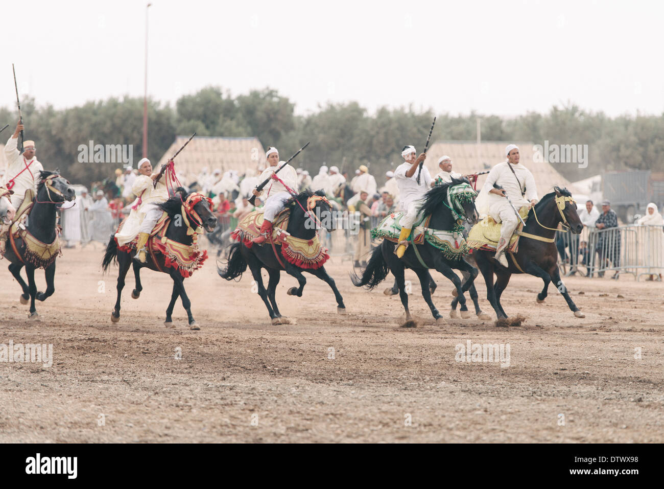 Horseriders performing at a Moroccan horse festival known as 'fantasia' Stock Photo