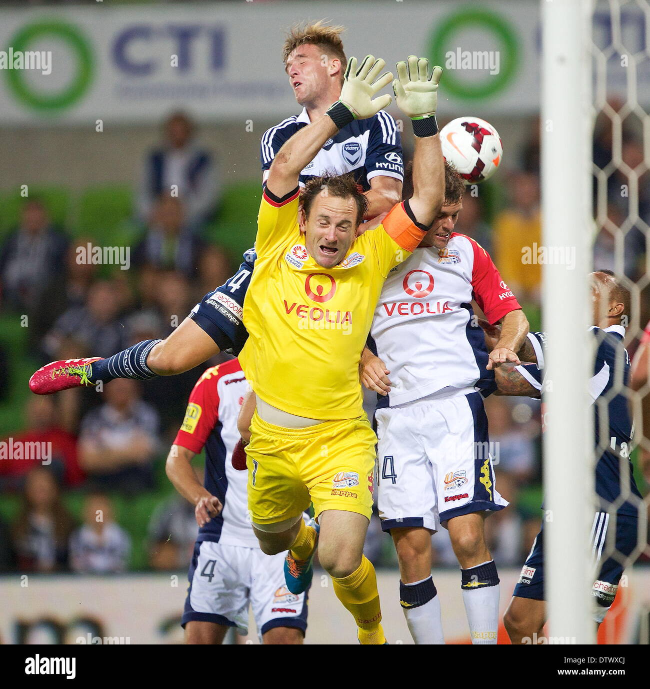 Melbourne, Australia. 22nd Feb, 2013. NICHOLA ANSELL (4) defender of Melbourne Victory tries to head the ball against EUGENE GALEKOVIC of Adelaide United during the round 20 match between Melbourne Victory and Adelaide United during the Australian Hyundai A-League season 2013/2014 at AAMI Park, Melbourne, Australia. © Tom Griffiths/ZUMA Wire/ZUMAPRESS.com/Alamy Live News Stock Photo