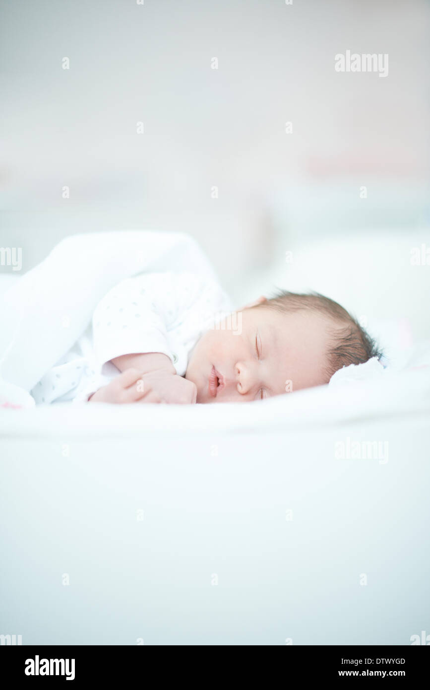 Newborn Baby Laying on White Bed Stock Photo Alamy
