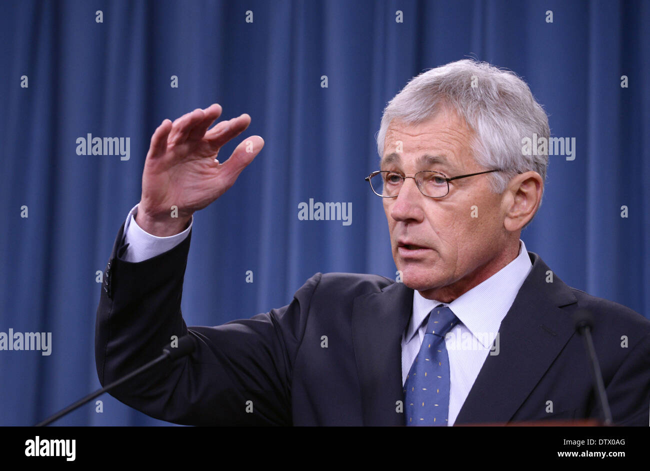 Washington DC, USA. 24th Feb, 2014. U.S. Secretary of Defense Chuck Hagel attends a press conference at the Pentagon, Washington DC, the United States, Feb. 24, 2014. U.S. Defense Secretary Chuck Hagel outlined on Monday his priorities for 2015 defense budget cut, including plans to reduce the size of the U.S. army to its pre-World War II levels. Credit:  Yin Bogu/Xinhua/Alamy Live News Stock Photo