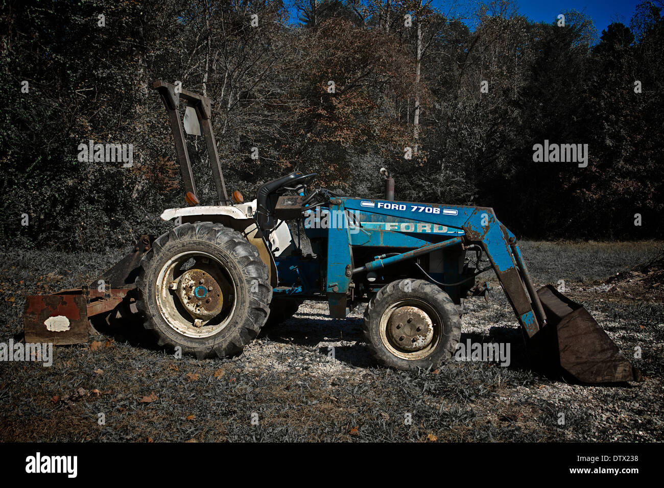 Old Ford Tractor in a Fall Setting Stock Photo