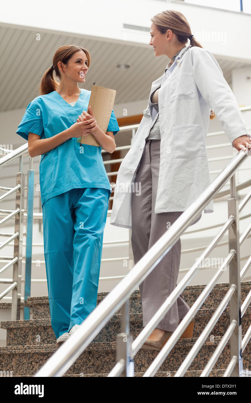 Female doctor talking to an intern Stock Photo