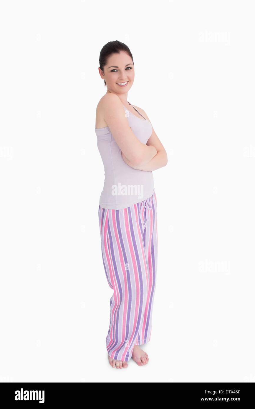 Woman standing in pyjamas Stock Photo