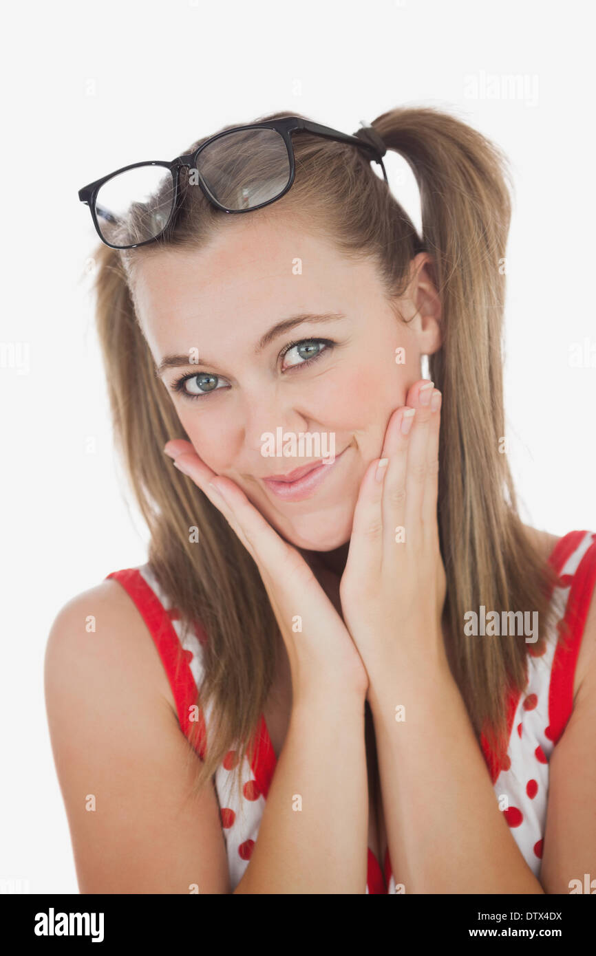 Beautiful young woman with hands on face Stock Photo - Alamy