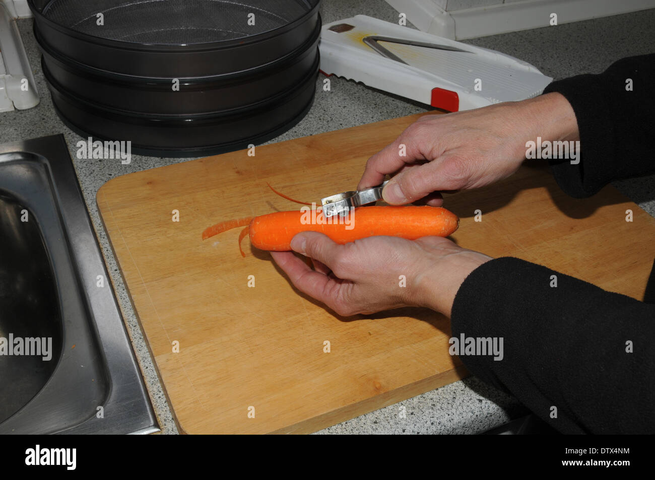 Preparing carrots Stock Photo