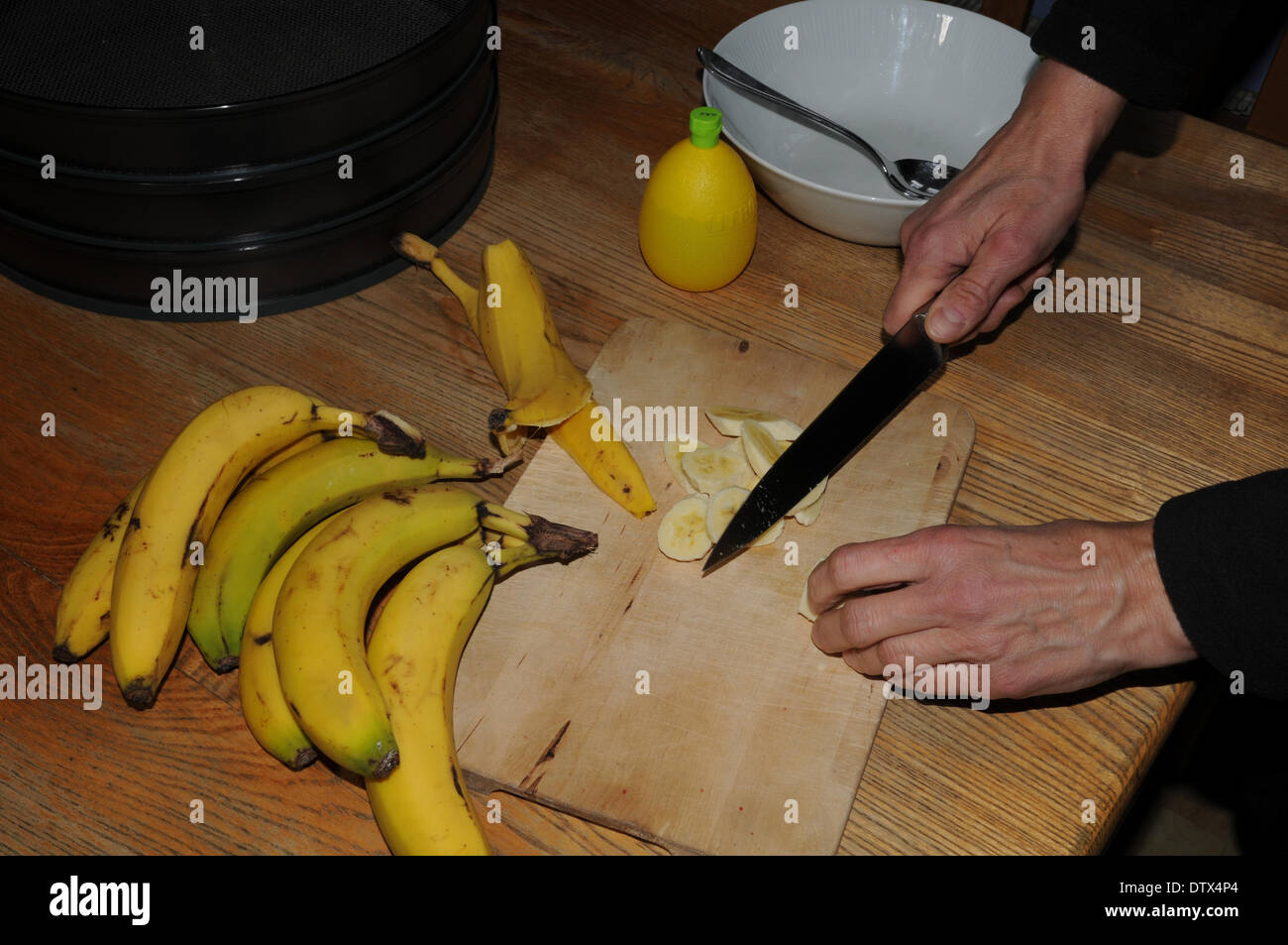 Cutting bananas Stock Photo