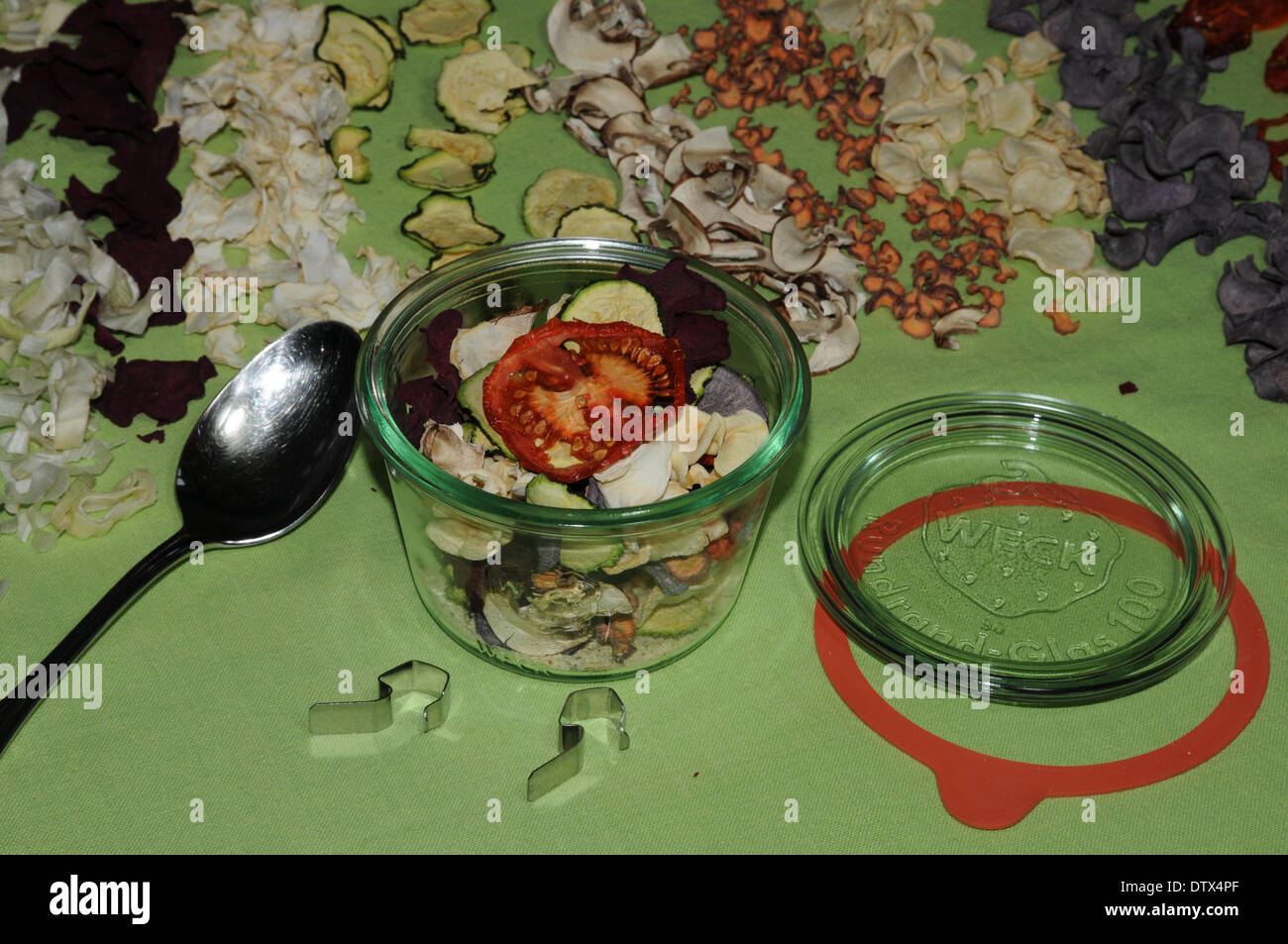 filling dried vegetables in a glass Stock Photo