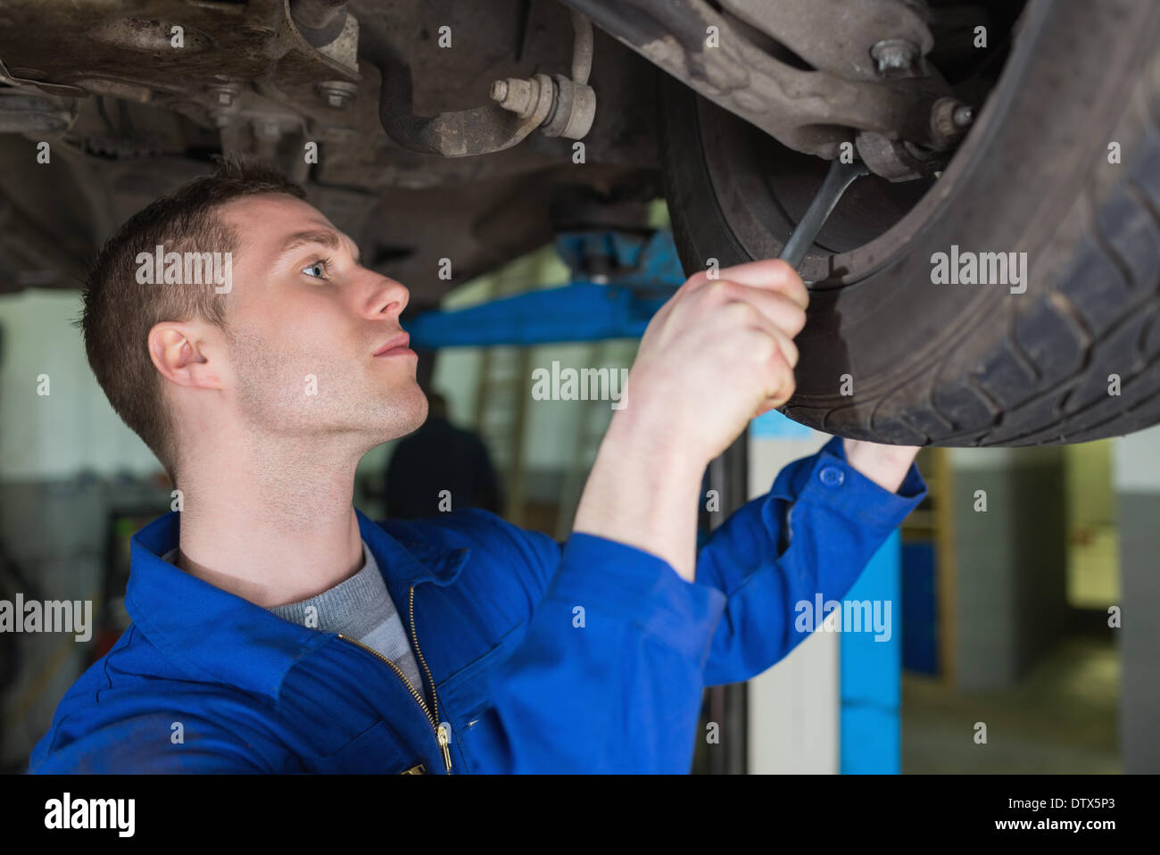 Auto mechanic repairing car with spanner Stock Photo Alamy