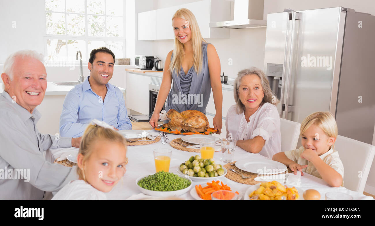 Happy mother serving a turkey Stock Photo Alamy