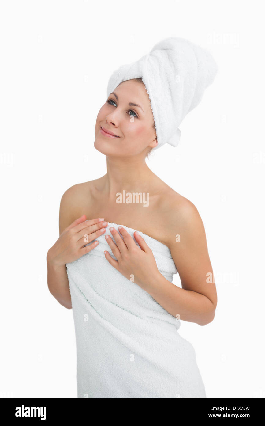 Happy young woman wrapped in towel Stock Photo - Alamy