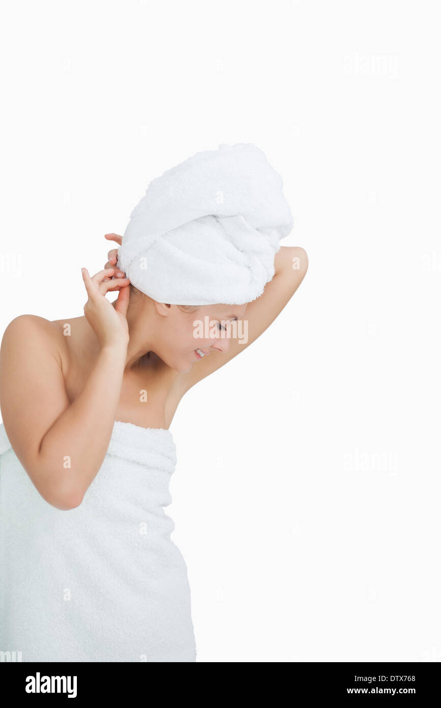 Happy young woman wrapped in towel Stock Photo - Alamy