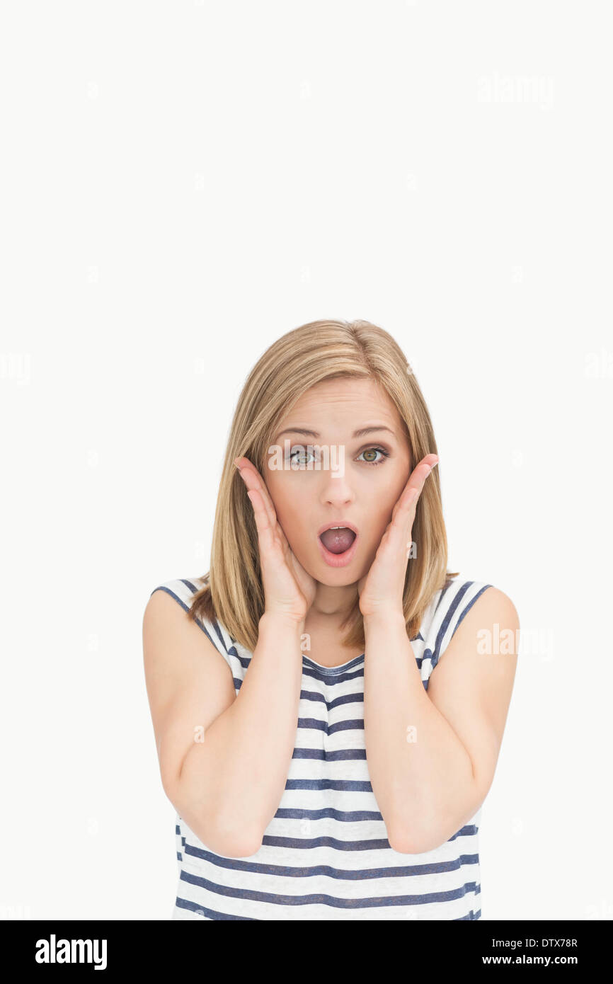 Portrait of surprised casual young woman Stock Photo - Alamy
