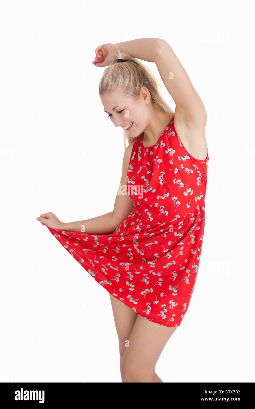 Young woman in red summer dress dancing Stock Photo - Alamy