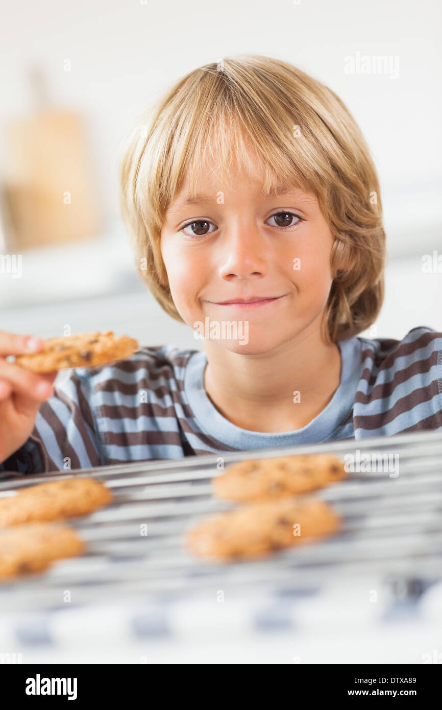Boy taking cookie hires stock photography and images Alamy