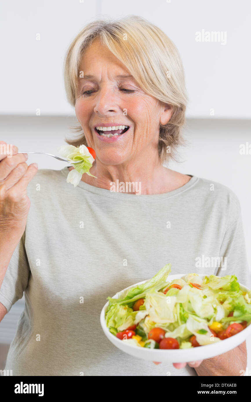 Mature woman eating salad Stock Photo Alamy