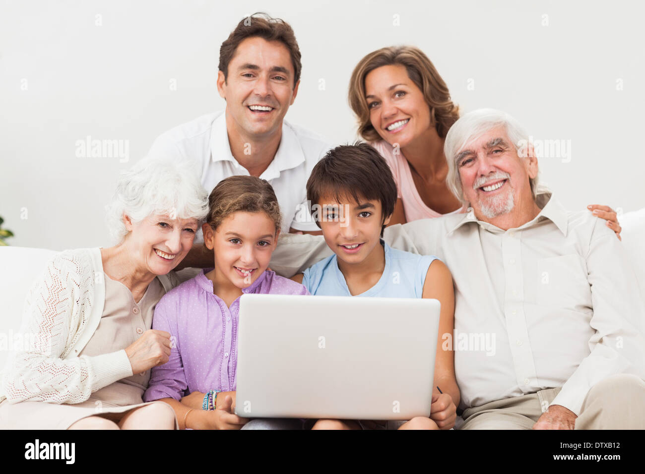 Multigeneration family on couch Stock Photo