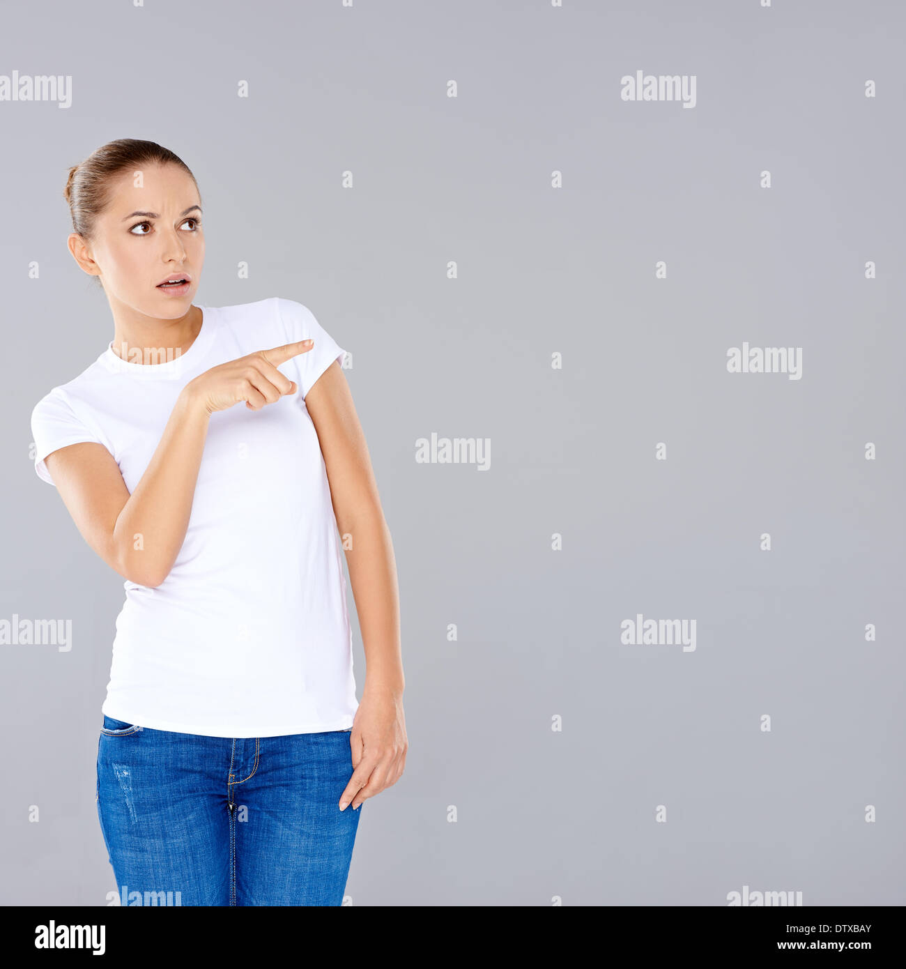 Woman pointing in disbelief Stock Photo