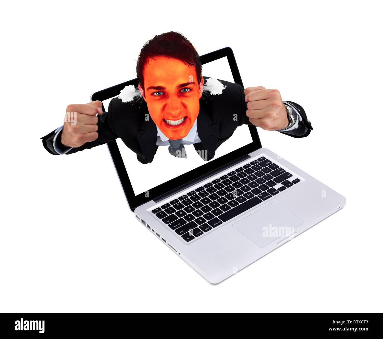 Angry man coming out from laptop Stock Photo