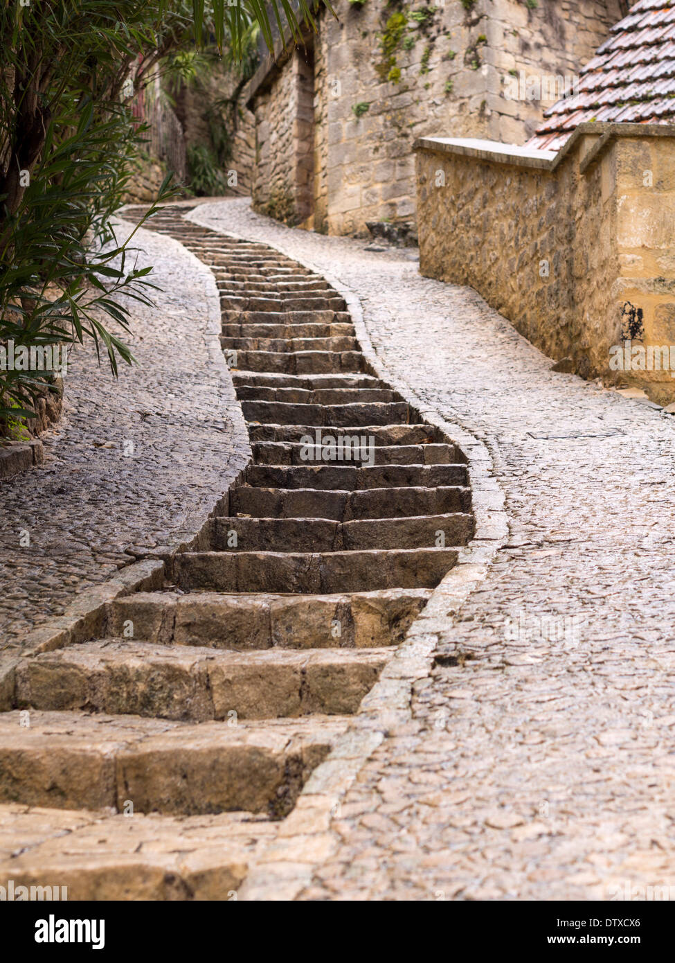 Winding stairs up La Roche. Stone stairs make it easier to navigate the steep lanes in this cliff-side village. Stock Photo
