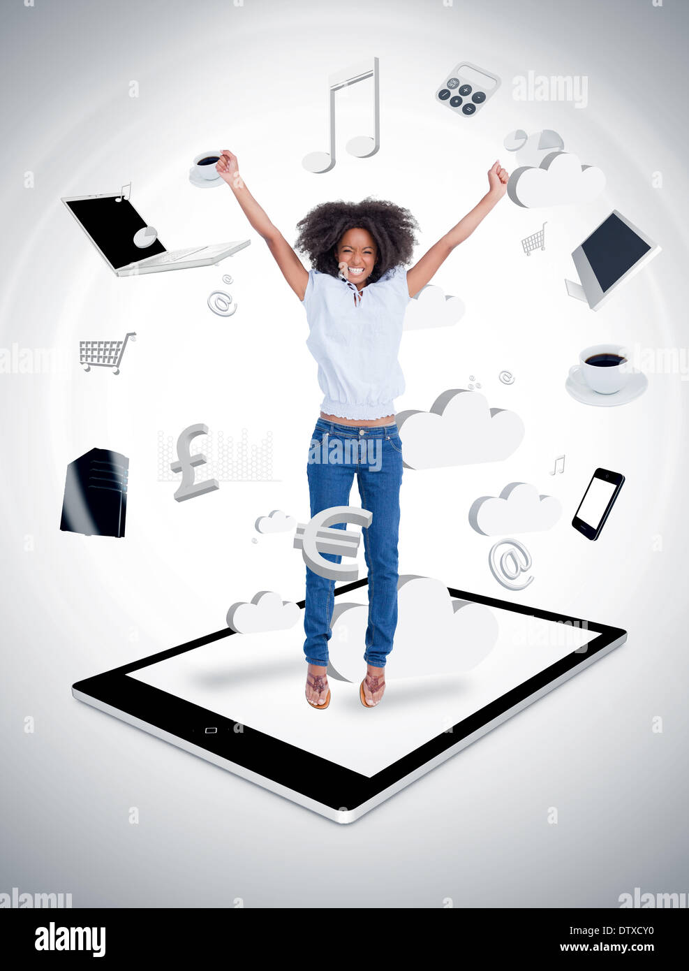 Cheerful woman jumping on a tablet pc Stock Photo Alamy
