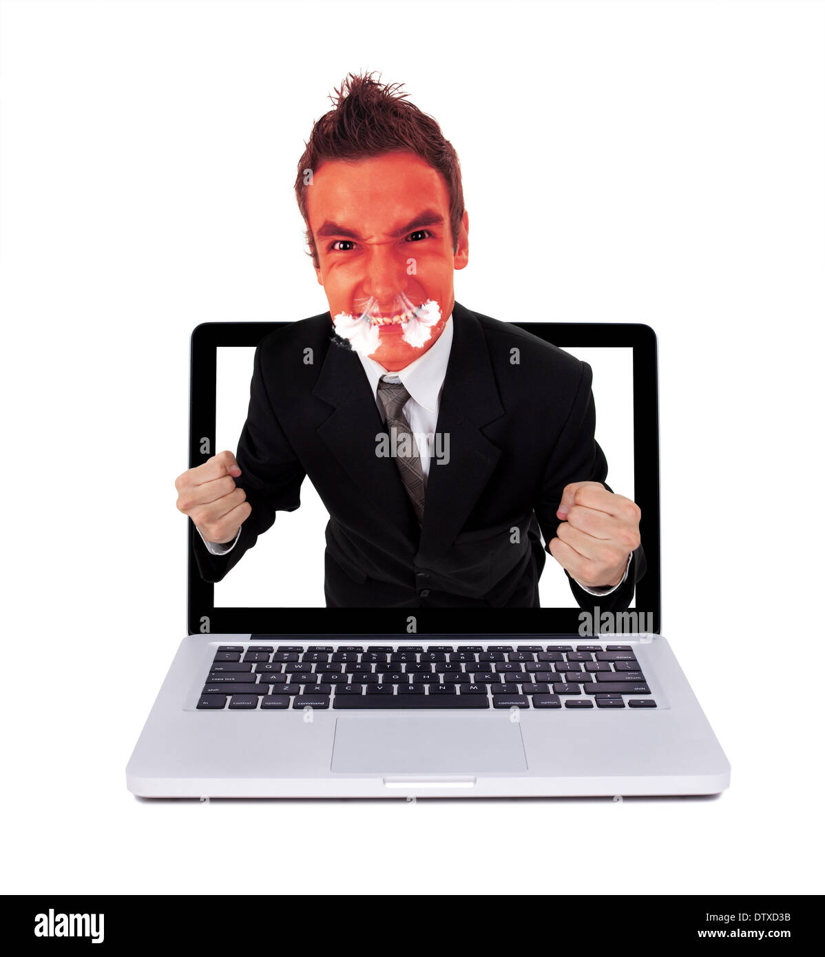 Angry man coming out from laptop Stock Photo