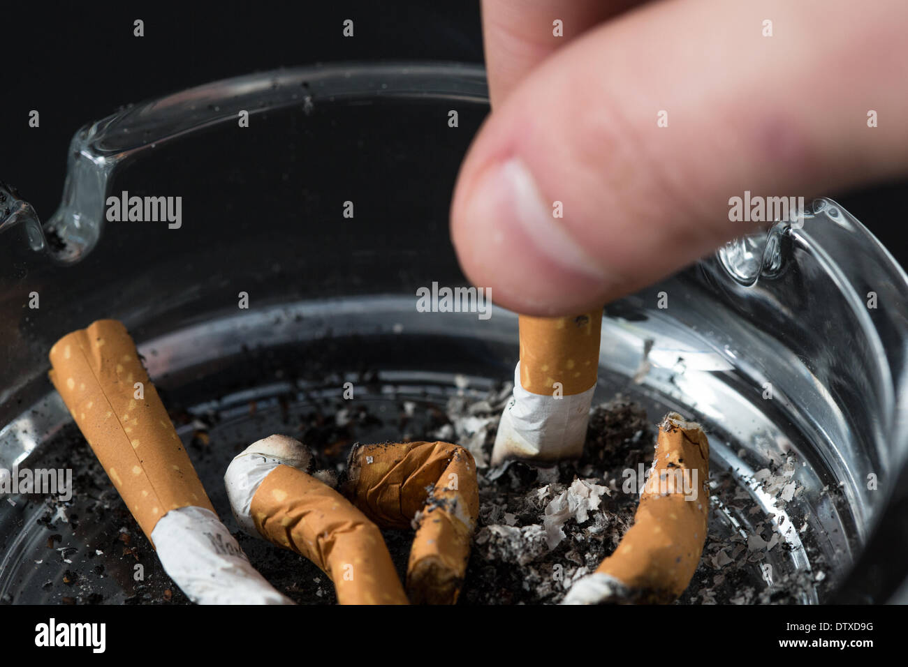 Putting out a cigarette hires stock photography and images Alamy