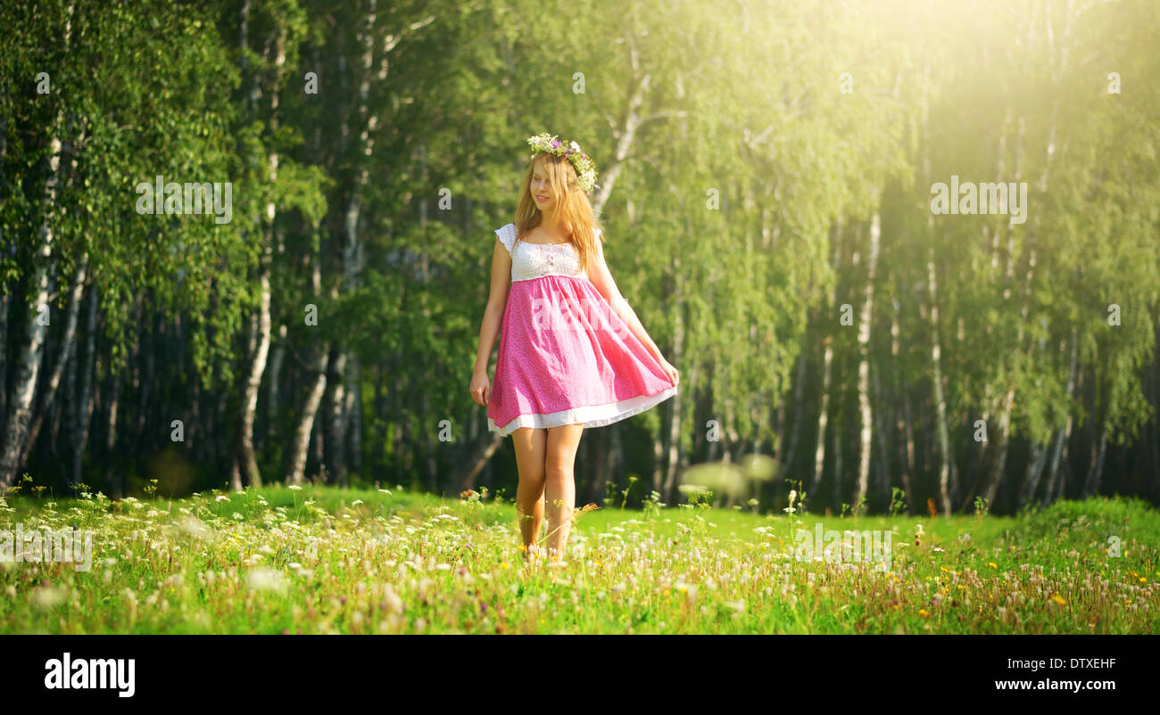 girl walking on meadow Stock Photo - Alamy