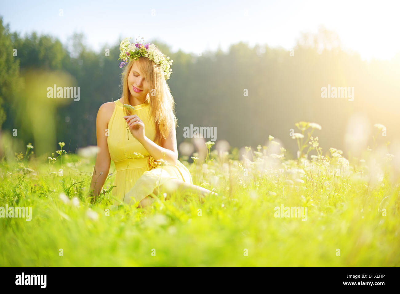Portrait of girl lying on flower meadow hi-res stock photography and ...