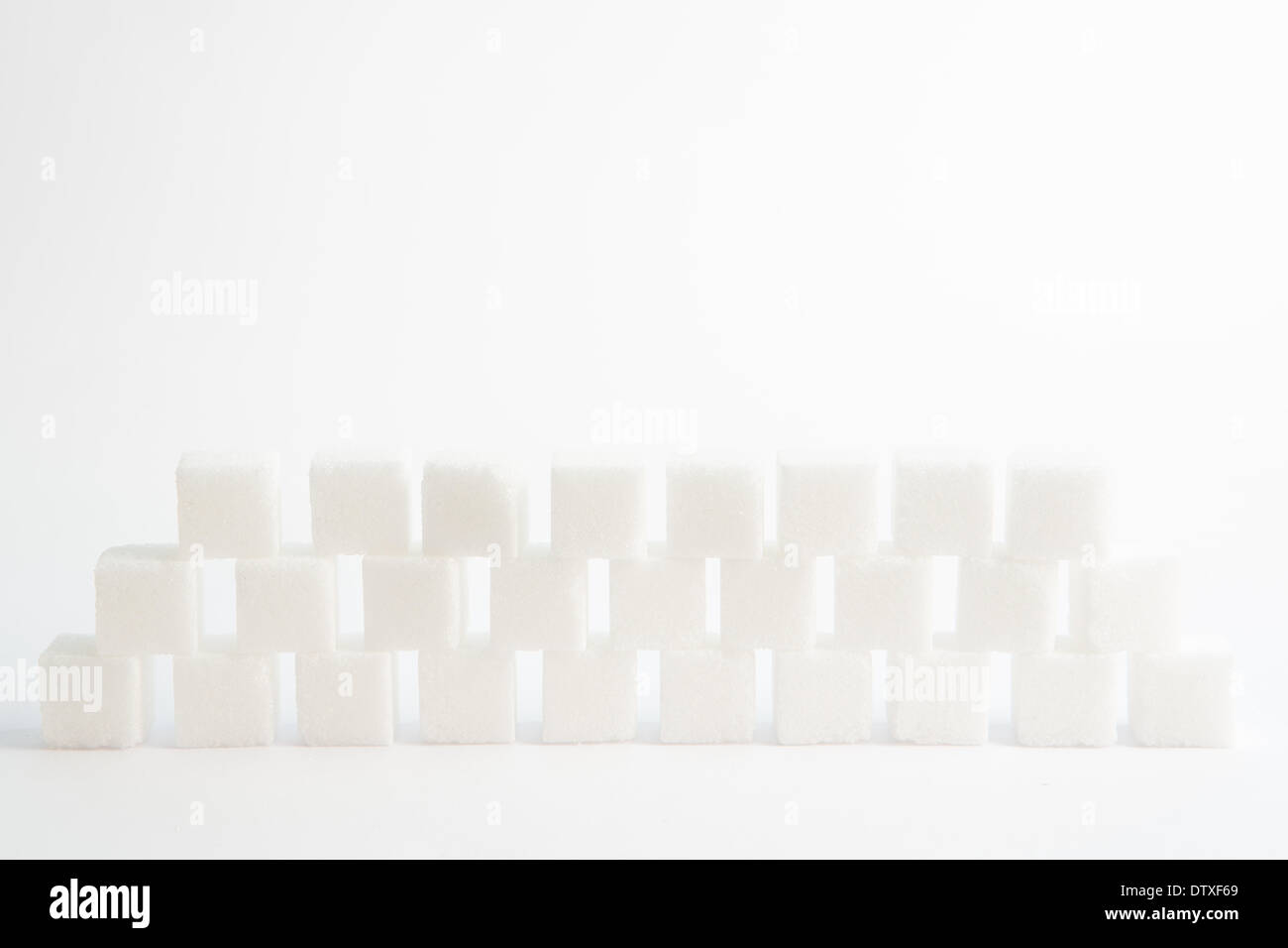 Sugar cubes piled up together Stock Photo Alamy
