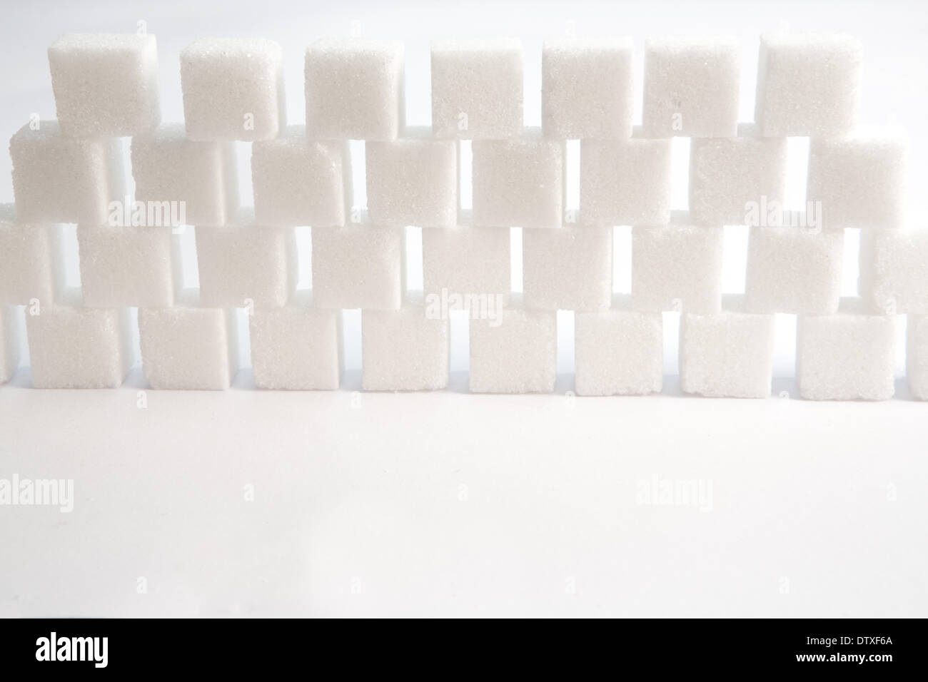 Sugar lumps piled up together Stock Photo - Alamy
