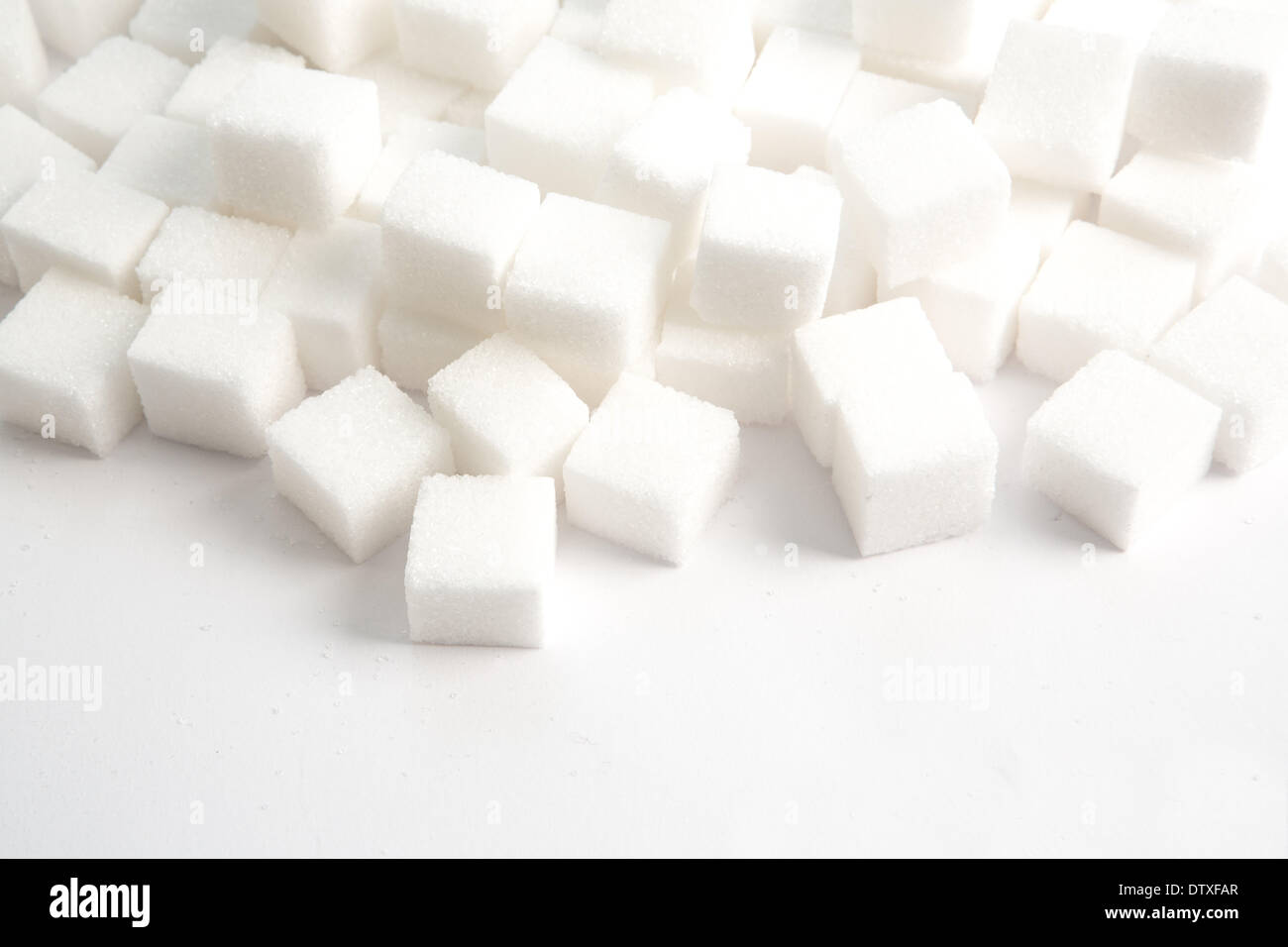 Sugar lumps stacked Stock Photo - Alamy