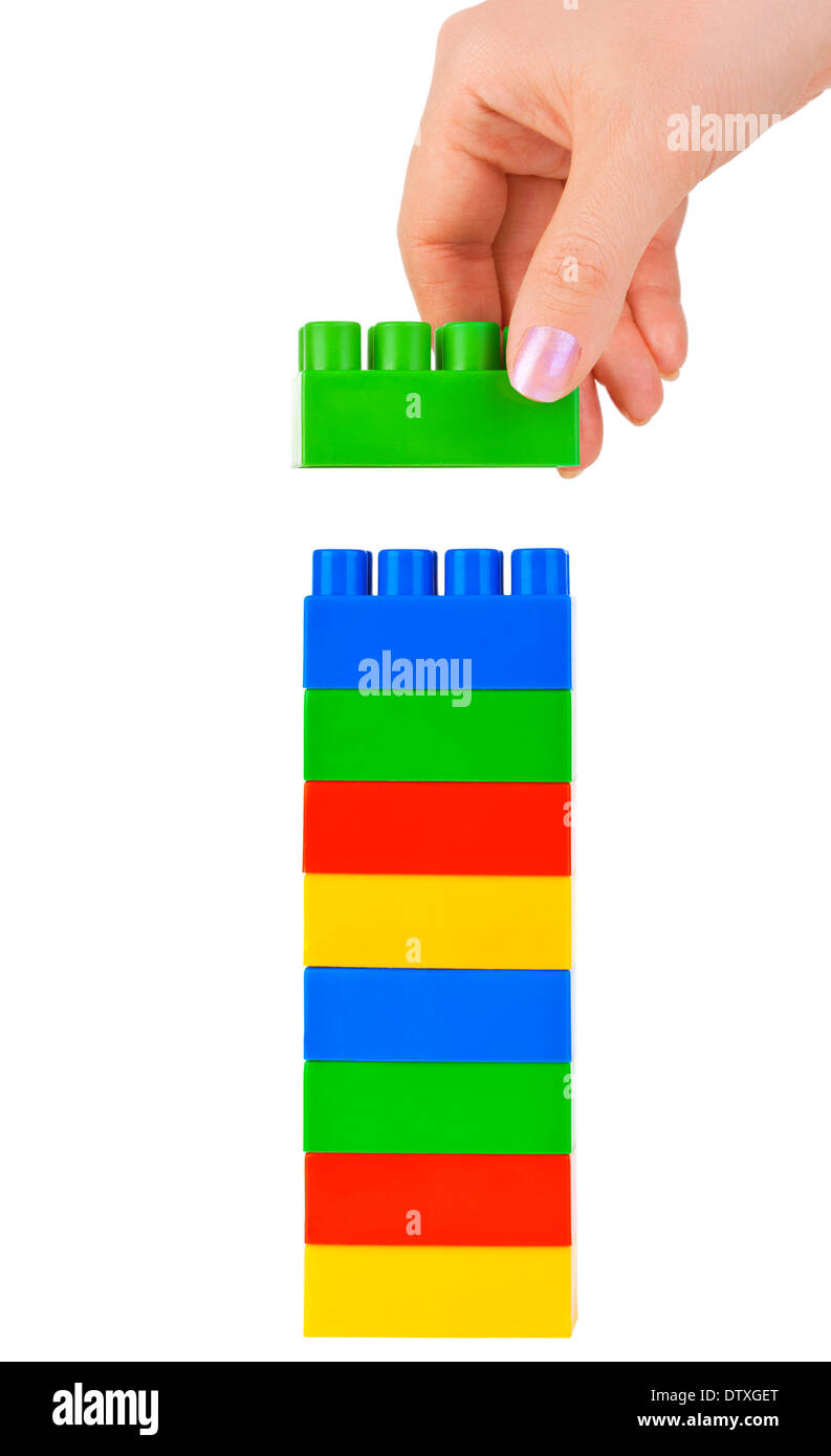 Hand and toy tower Stock Photo