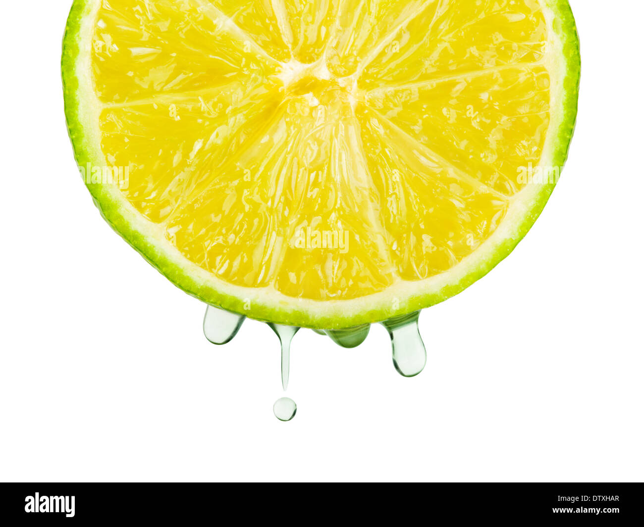 Juice drops on lime Stock Photo