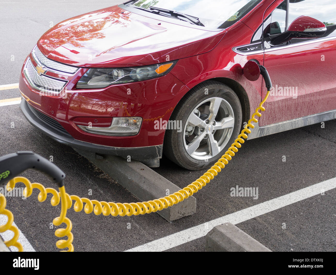 Charging an Electric Car. A plugin Chevrolet Volt car plugged into a