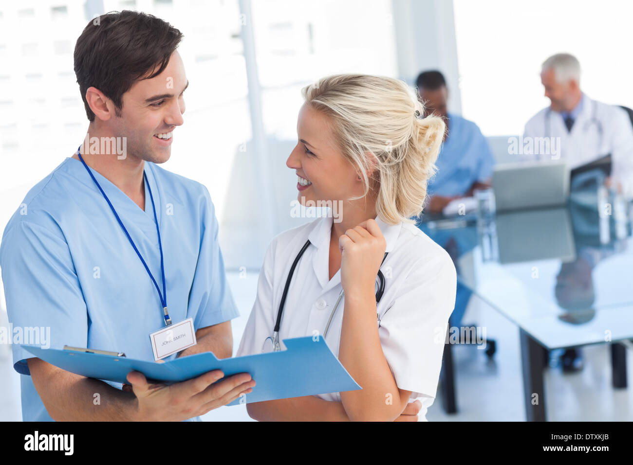 Two young doctors talking hi-res stock photography and images - Alamy