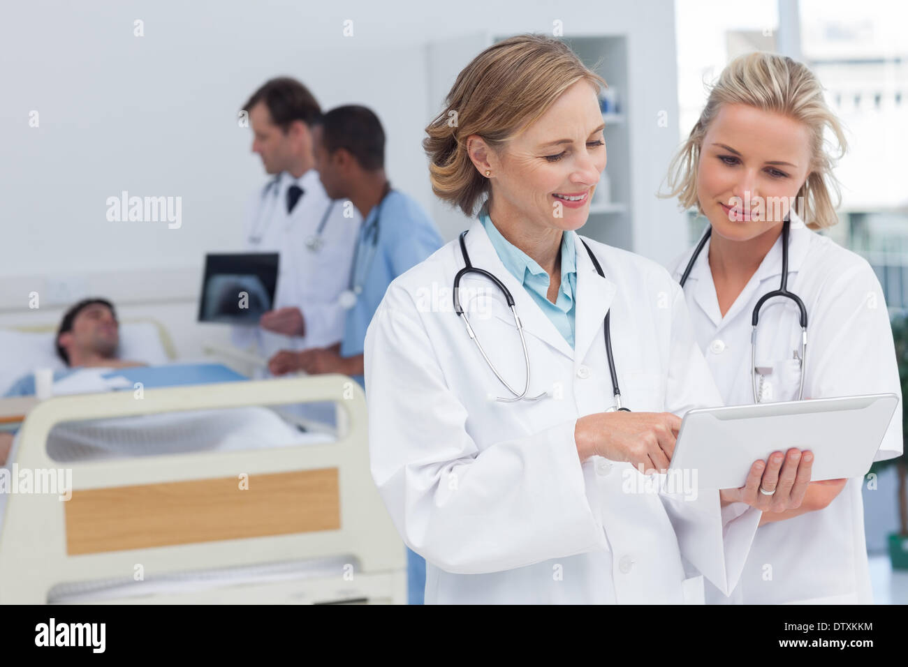 Two women doctors looking at tablet Stock Photo