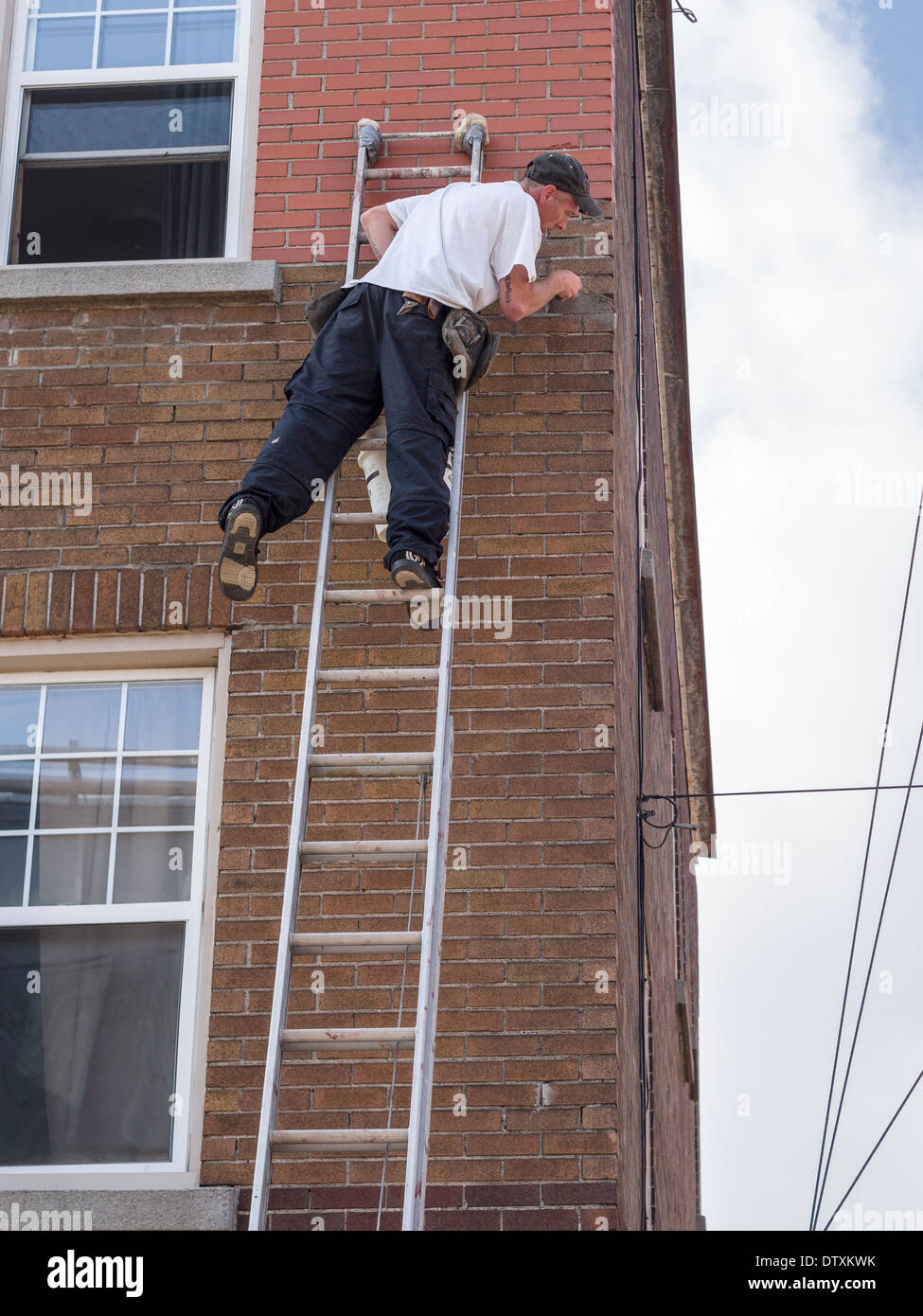 Man balance ladder hi-res stock photography and images - Alamy