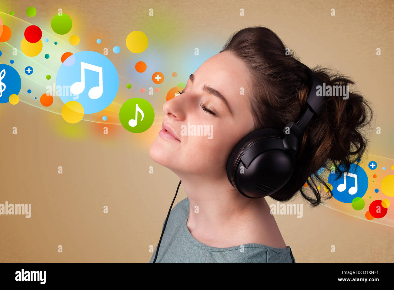 Young woman listening to music with headphones Stock Photo - Alamy