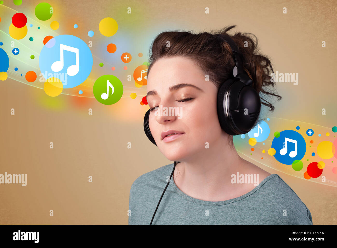 Young woman listening to music with headphones Stock Photo - Alamy