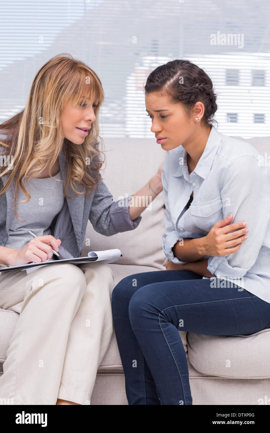 Psychotherapist helping a depressed patient Stock Photo