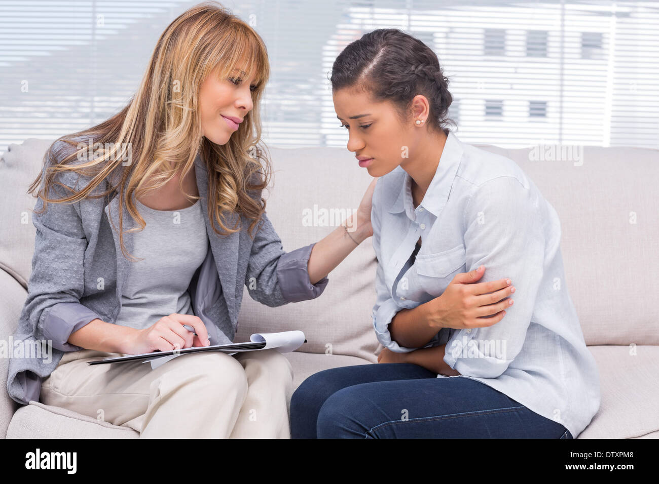 Psychotherapist helping a patient Stock Photo