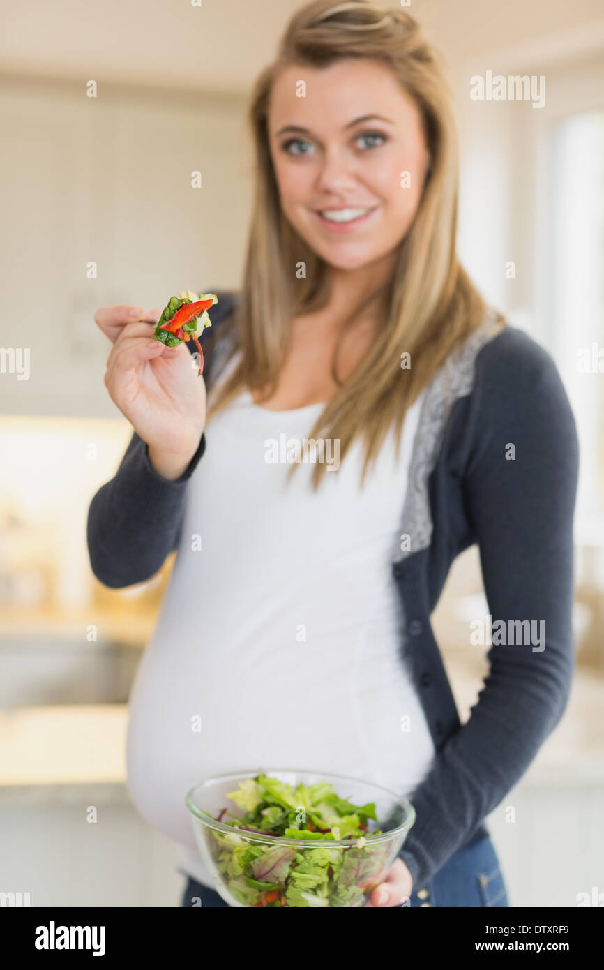 Pregnant woman eating fresh salad Stock Photo Alamy