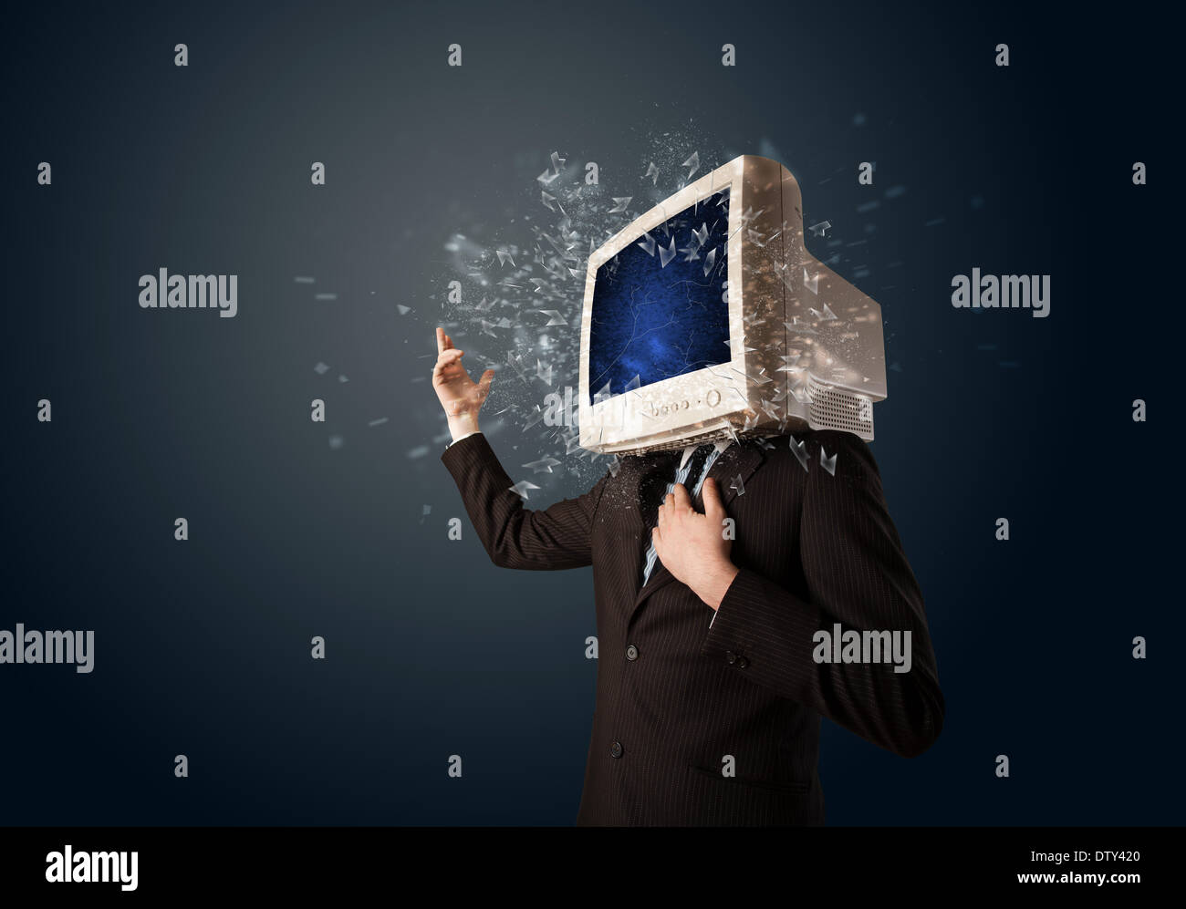 Computer monitor screen exploding on a young persons head Stock Photo
