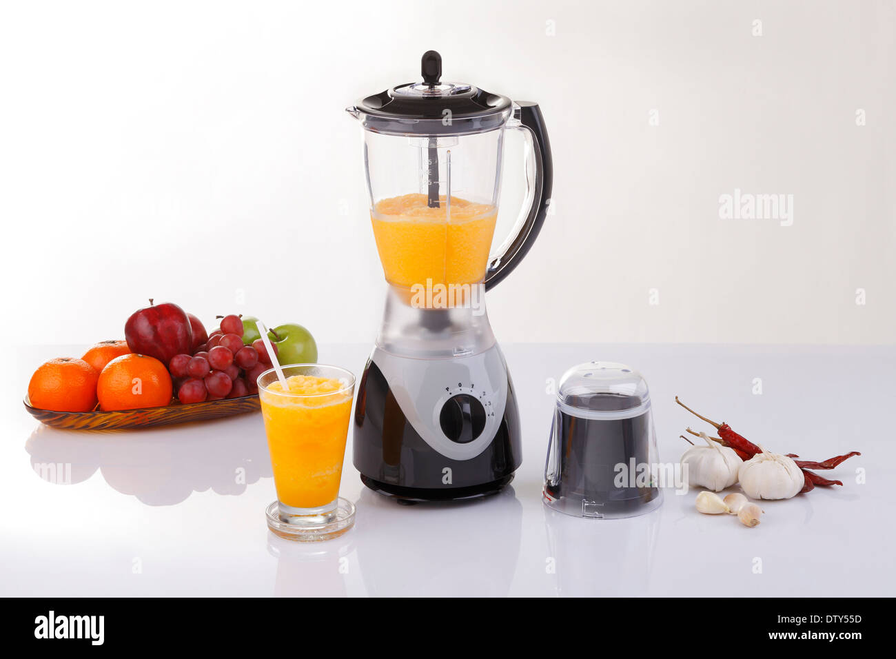 Electric blender with fruits and orange juice Stock Photo Alamy