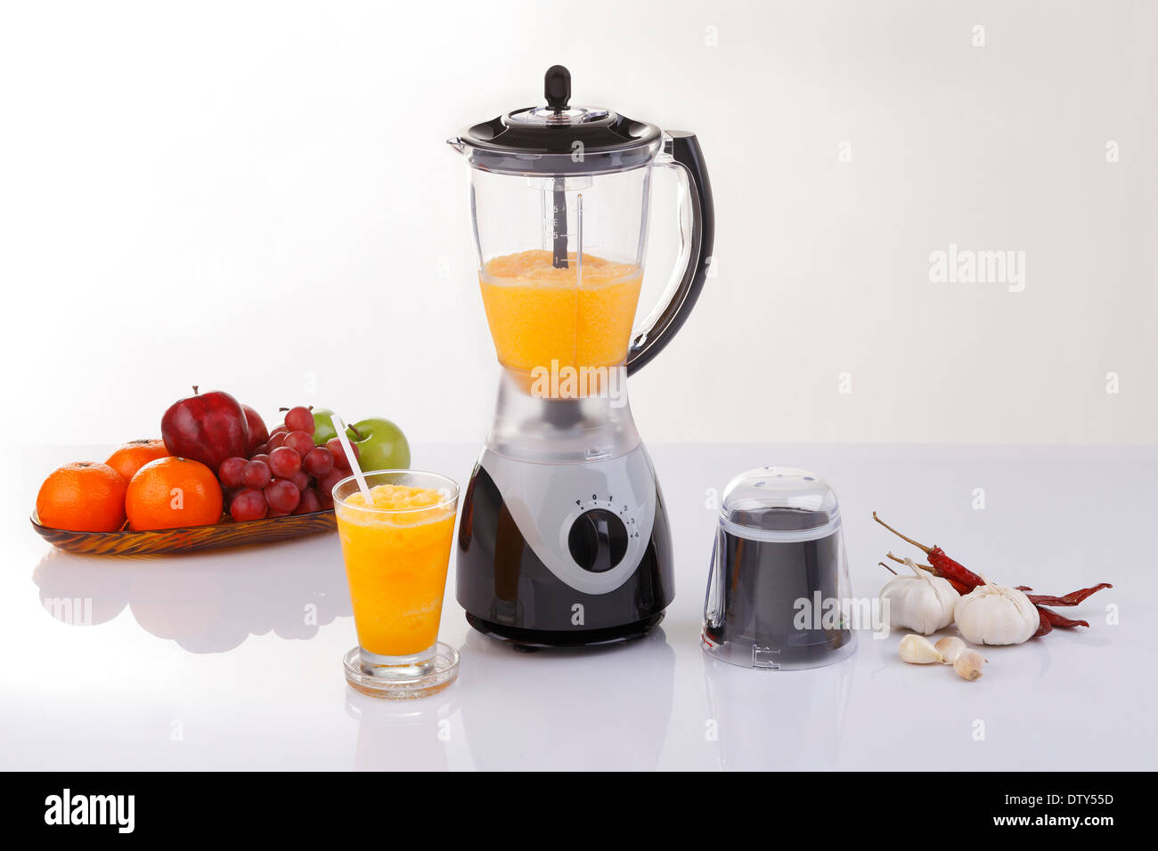Electric blender with fruits and orange juice Stock Photo