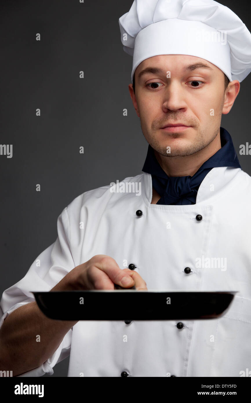 chef holding pan Stock Photo Alamy