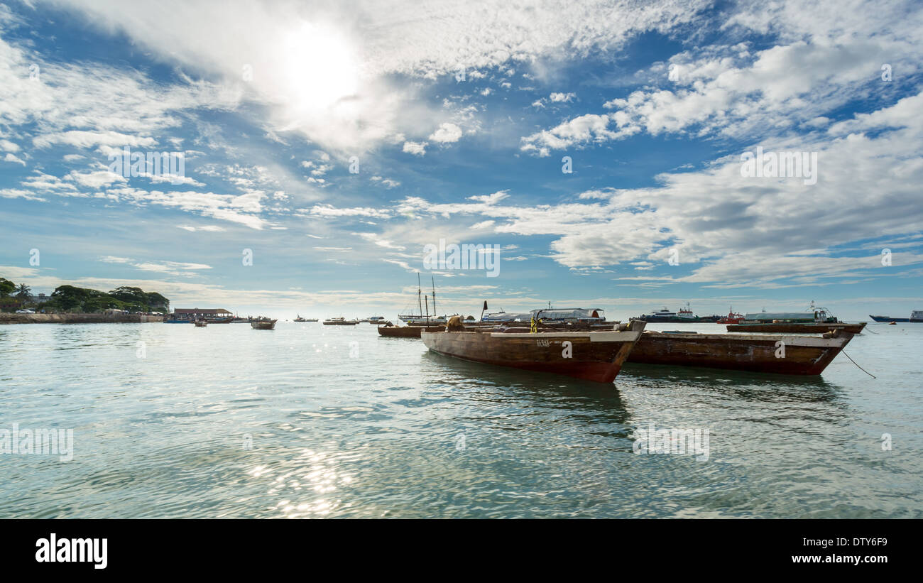 Two old wooden boats floating on the shores of Zanzibar, Tanzania Stock Photo