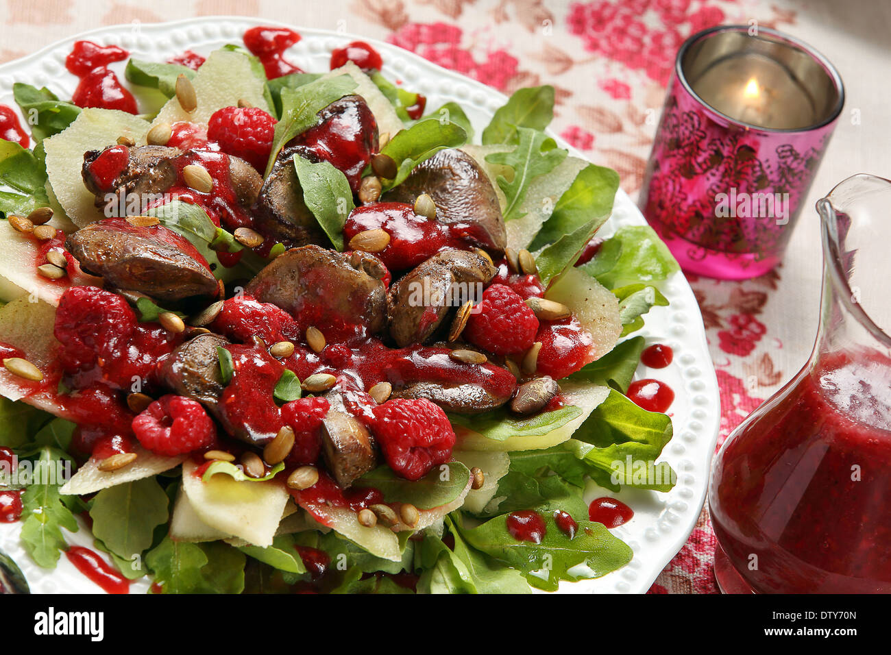 Chicken liver with pears and roasted pumpkin seeds in raspberry sauce